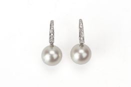 A PAIR OF CULTURED PEARL AND DIAMOND EARRINGS