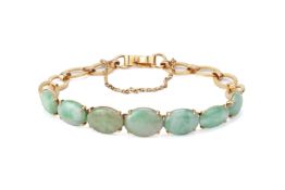 A JADE AND GOLD BRACELET