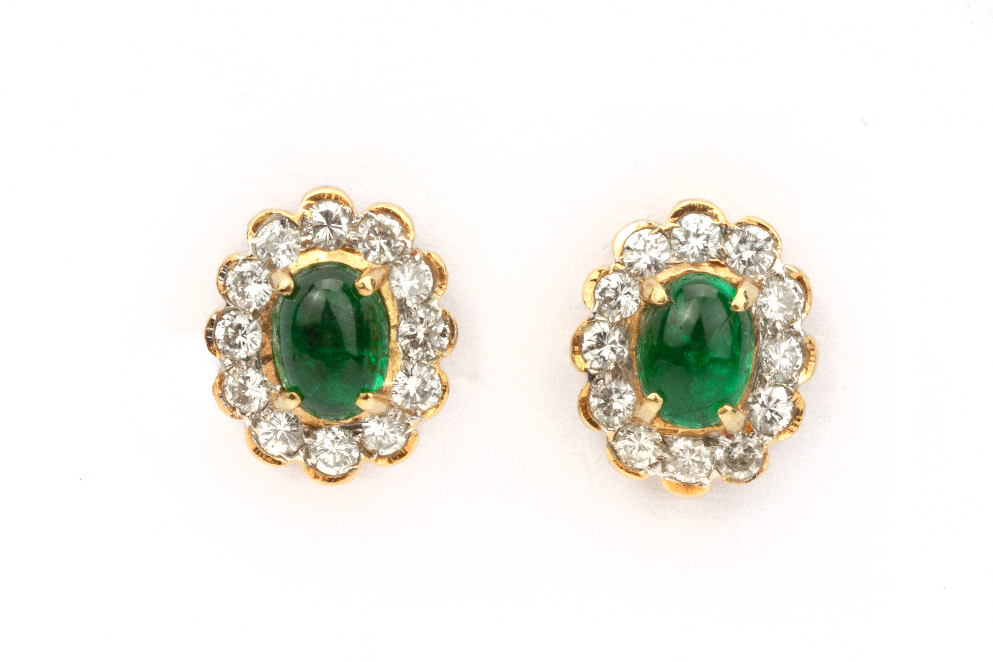 A PAIR OF EMERALD AND DIAMOND CLUSTER EARRINGS