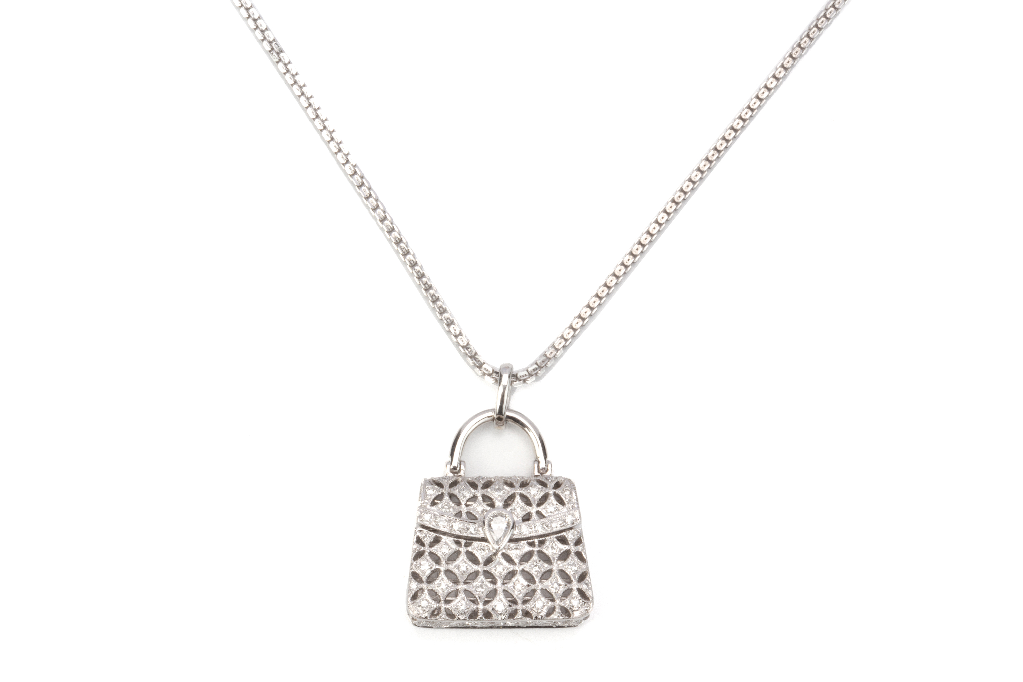 A DIAMOND HANDBAG PENDANT WITH ADJUSTABLE CHAIN