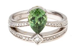 A DEMANTOID GARNET AND DIAMOND RING