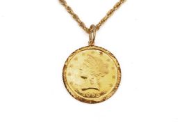 A GOLD MEDALLION PENDANT ON CHAIN