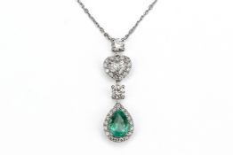 AN EMERALD AND DIAMOND PENDANT NECKLACE