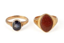 A GOLDSTONE SIGNET RING AND A SYNTHETIC SAPPHIRE RING