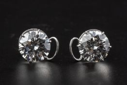 A FINE AND LARGE PAIR OF DIAMOND STUD EARRINGS