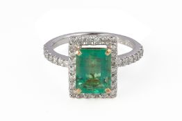 AN EMERALD AND DIAMOND RING