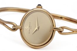 A BAUME & MERCIER LADIES GOLD BANGLE STYLE WATCH