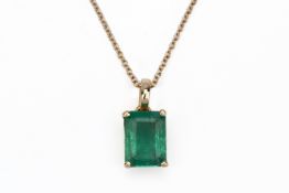 AN EMERALD PENDANT ON CHAIN