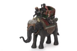 A COLD PAINTED BRONZE MODEL OF A MONKEY RIDING AN ELEPHANT