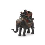 A COLD PAINTED BRONZE MODEL OF A MONKEY RIDING AN ELEPHANT