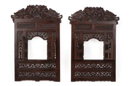 A PAIR OF INDONESIAN CARVED WOOD WINDOWS