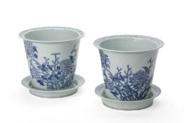 A PAIR OF BLUE AND WHITE PORCELAIN JARDINIERES AND STANDS