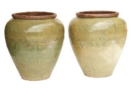 A PAIR OF VERY LARGE OLIVE GREEN GLAZED POTS