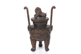 A LARGE CARVED WOOD TWIN HANDLED TRIPOD CENSER