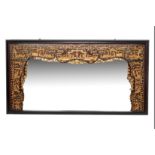 A VERY LARGE CARVED AND GILT WALL MIRROR