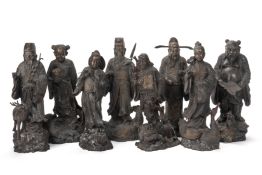 A SET OF EIGHT CAST BRONZE FIGURES OF IMMORTALS