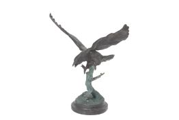 A LARGE CAST METALWARE MODEL OF AN EAGLE