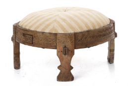 AN INDIAN CARVED WOOD 'CHAKKI' TABLE