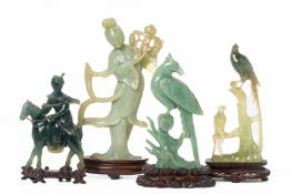 FOUR CHINESE JADE / SERPENTINE CARVINGS OF FIGURES AND BIRDS