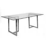 A CONTEMPORARY GLASS AND CHROME DINING TABLE