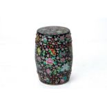 A BLACK GROUND FAMILLE ROSE PORCEALIN DRUM STOOL