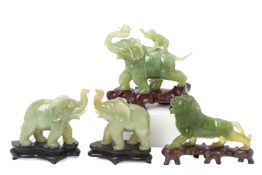 A GROUP OF FOUR CHINESE JADE/SERPENTINE CARVINGS OF ANIMALS