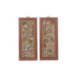 A PAIR OF CARVED AND POLYCHROME DECORATED WOOD PANELS