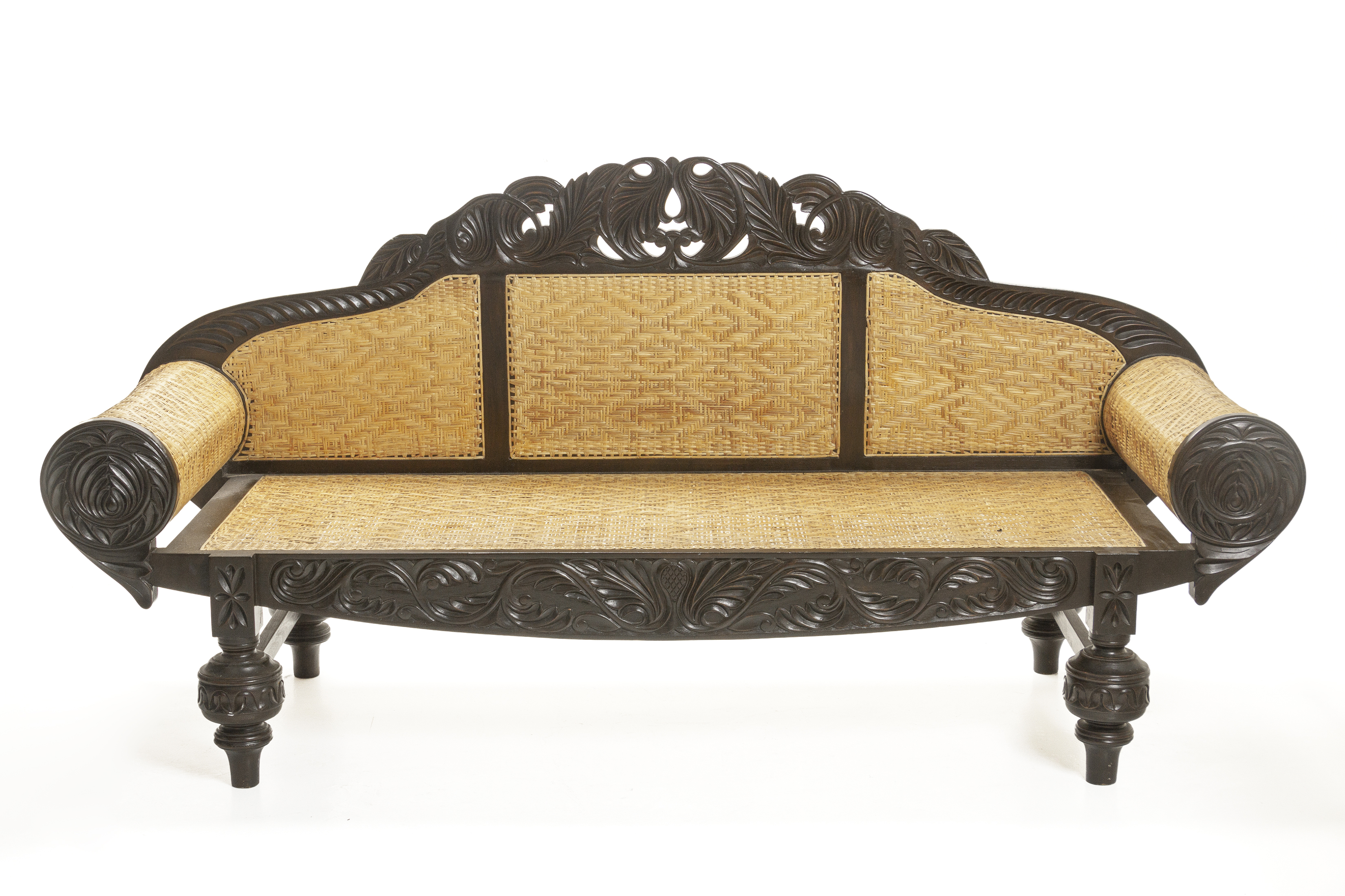 AN ANGLO INDIAN CARVED TEAK SOFA