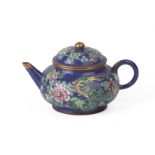 AN ENAMELLED YIXING POTTERY TEAPOT