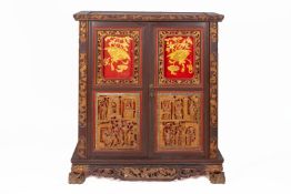 A CARVED AND GLAZED CABINET