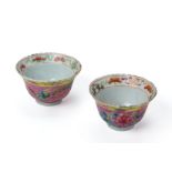 A PAIR OF SMALL PINK GROUND FAMILLE ROSE TEA CUPS