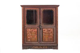 A CARVED AND GLAZED CABINET