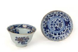 A GILDED BLUE AND WHITE TEA BOWL AND DISH