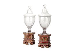 A PAIR OF GLASS VASES AND COVERS / OIL LAMPS ON STANDS