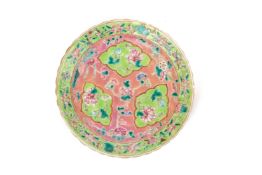 A PINK GROUND FAMILLE ROSE 'FOUR SEASONS' FLORAL PLATE