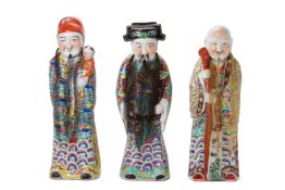 A SET OF THREE PORCELAIN FU LU SHOU FIGURES