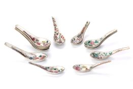 A GROUP OF FOURTEEN FAMILLE ROSE 'PHOENIX' SPOONS