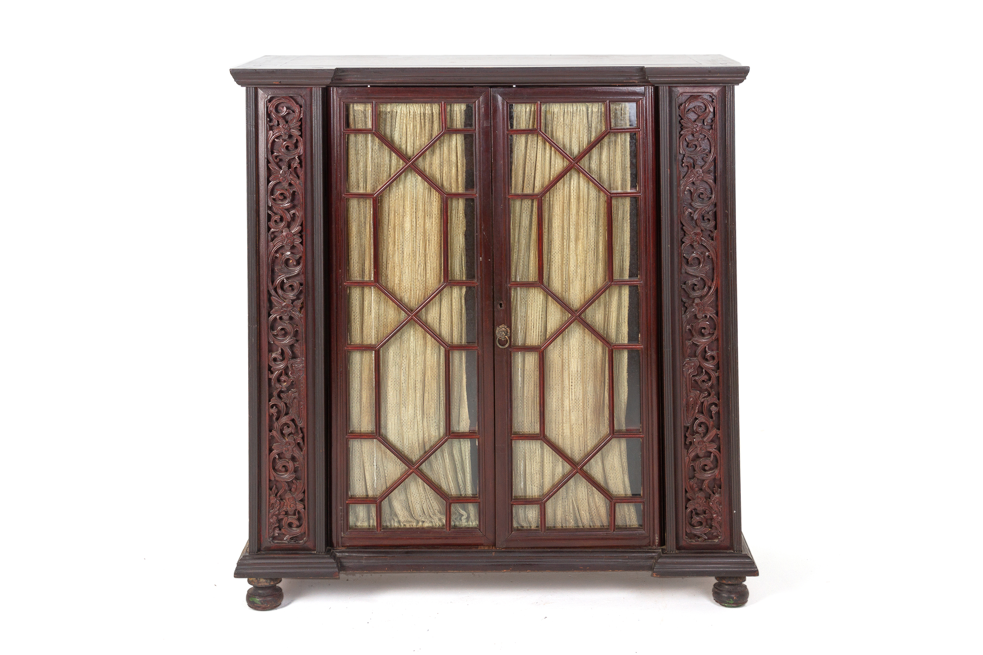 A CARVED AND GLAZED CABINET