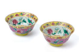 A PAIR OF PINK GROUND FAMILLE ROSE 'IN-AND-OUT' TEA BOWLS