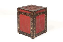 A SQUARE BLACK AND RED LACQUER BOX
