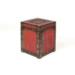 A SQUARE BLACK AND RED LACQUER BOX