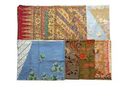 A GROUP OF SEVEN BATIK SARONGS (FOUR EXAMPLES SIGNED)