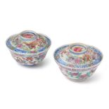 A PAIR OF FAMILLE ROSE TEA BOWLS AND COVERS