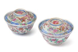 A PAIR OF FAMILLE ROSE TEA BOWLS AND COVERS