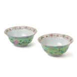 A PAIR OF LIME GREEN GROUND FAMILLE ROSE BOWLS