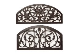 A PAIR OF ARCHED CARVED AND PIERCED WOOD PANELS