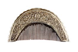 A REPOUSSE SILVER MOUNTED COMB