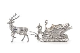 A GERMAN SILVER MODEL OF A REINDEER AND SLEIGH