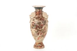 A JAPANESE SATSUMA EARTHENWARE TWIN HANDLED VASE