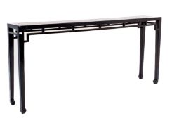 A SLIM BLACK LACQUER CONSOLE TABLE